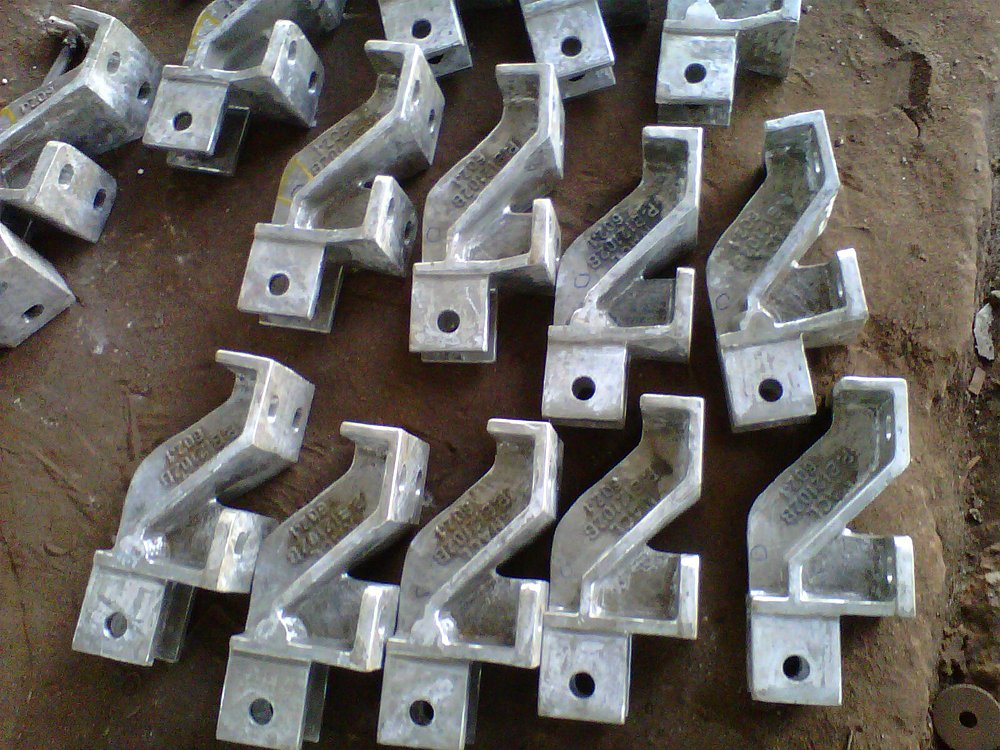 Rows of cast HK40 tube-support hangers with cast-in grade and heat marks