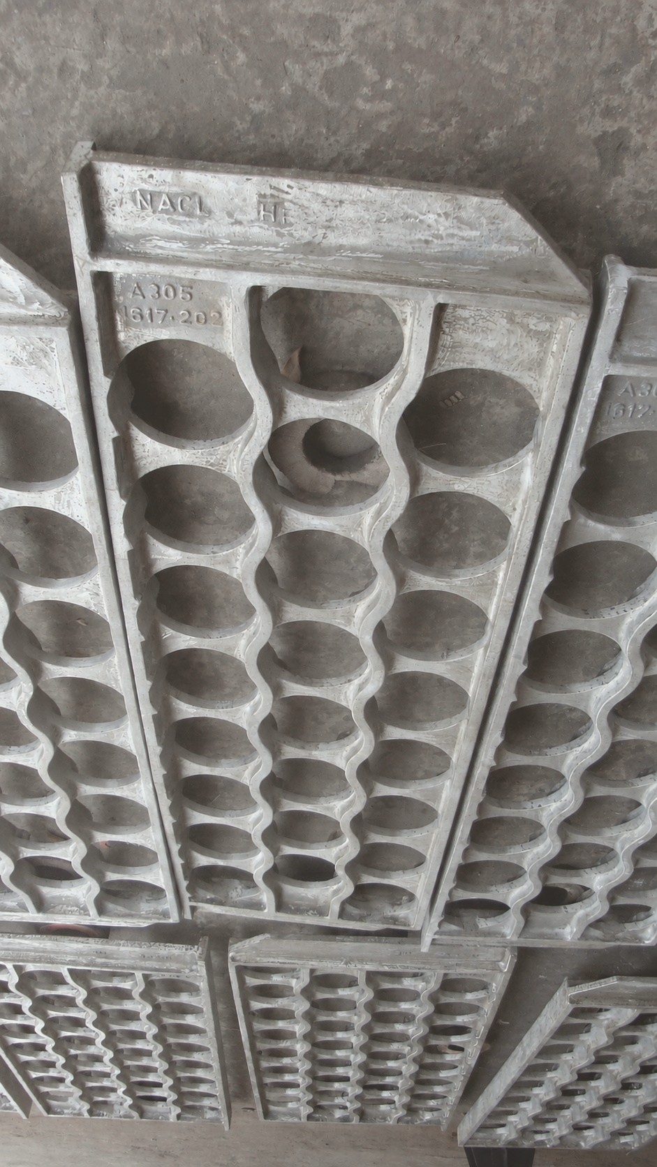 Cast reformer tube sheet with a full bored hole pattern